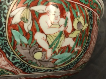 A Chinese wucai bowl with boys holding lotus flowers, Transitional period