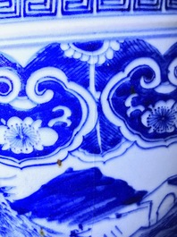 A Chinese blue and white fish bowl with a river landscape, 19th C.