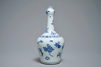 A Chinese blue and white bottle vase with floral design, Transitional period