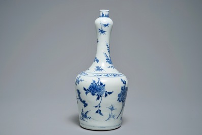 A Chinese blue and white bottle vase with floral design, Transitional period