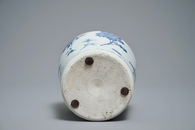 A Chinese blue and white bottle vase with floral design, Transitional period