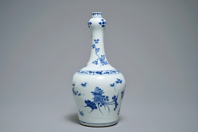 A Chinese blue and white bottle vase with floral design, Transitional period