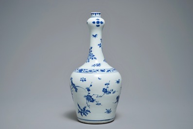 A Chinese blue and white bottle vase with floral design, Transitional period