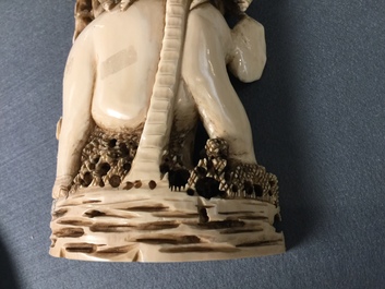 A Chinese carved ivory group of a lady with an elephant, 1st half 20th C.