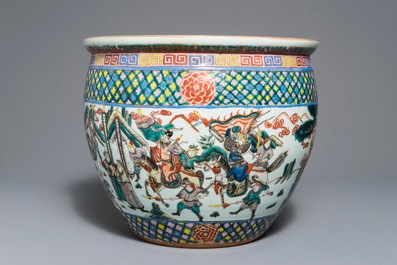 A Chinese famille verte fish bowl with warriors, 19th C.