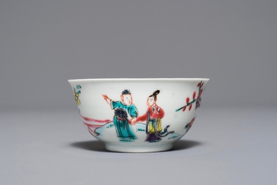 A Chinese famille rose 'Romance of the Western chamber' cup and saucer, Yongzheng/Qianlong