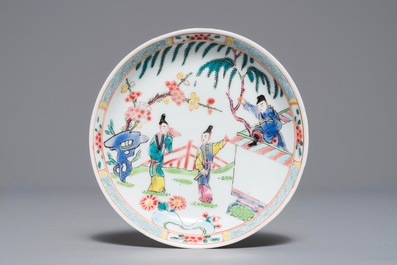 A Chinese famille rose 'Romance of the Western chamber' cup and saucer, Yongzheng/Qianlong