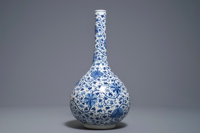 A Chinese blue and white 'lotus scroll' bottle vase, 18/19th C.