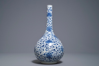 A Chinese blue and white 'lotus scroll' bottle vase, 18/19th C.