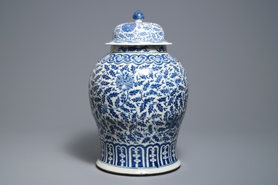 A Chinese blue and white 'lotus scroll' vase and cover, 19th C.