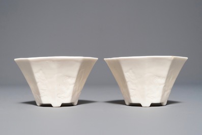 A pair of Chinese Dehua blanc de Chine wine cups with anhua design of horses, Transitional period