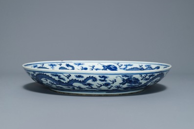 A Chinese blue and white 'dragon' dish, Qianlong mark, 19th C.