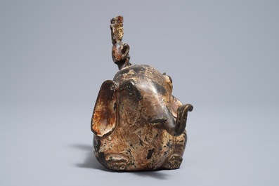 A Chinese bronze incense burner modelled as an elephant with female rider, Ming