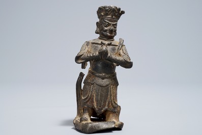 A Chinese bronze model of a guardian, Ming