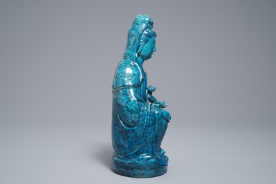 A Chinese turquoise-glazed and underglaze blue model of Guanyin, 19/20th C.