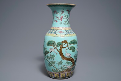 A Chinese famille rose turquoise ground vase, 19th C.