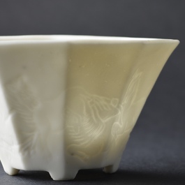 A pair of Chinese Dehua blanc de Chine wine cups with anhua design of horses, Transitional period