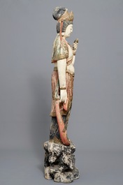 A tall Chinese painted and carved wood figure of Guanyin, 18/19th C.