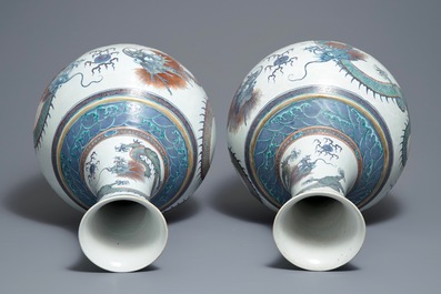 A pair of large Chinese doucai 'dragon' bottle vases, tianqiu ping, Qianlong mark, 19th C.