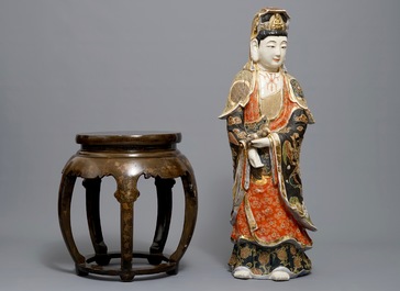 A large Japanese Satsuma figure of Kannon on laquered wooden stand, Meiji, 19/20th C.