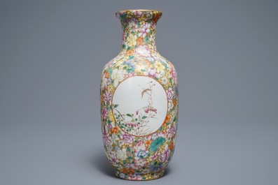 A Chinese famille rose millefleurs vase, Qianlong mark, 20th C.