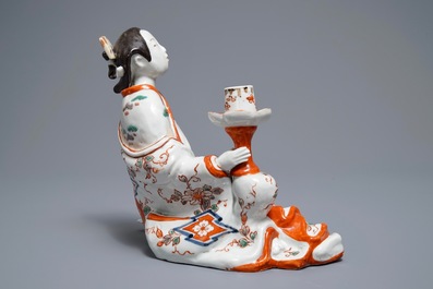 A Japanese Imari figure of a Bijin with candle holder, Edo, 17/18th C.