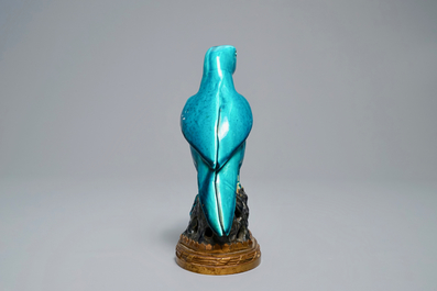 A Chinese turquoise-glazed parrot mounted on gilt bronze stand, Kangxi