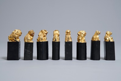 Eight Chinese parcel-gilt ink stones shaped as seals in display box, 18/19th C.