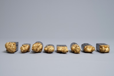 Eight Chinese parcel-gilt ink stones shaped as seals in display box, 18/19th C.