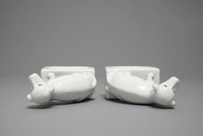 A pair of Chinese blanc de Chine models of dogs, seal mark, 18/19th C.