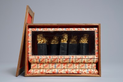 Eight Chinese parcel-gilt ink stones shaped as seals in display box, 18/19th C.