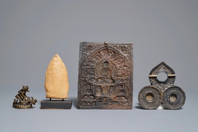 Two Tibetan votive plaques, a coral-inlaid silver amulet and a small bronze group, 18/19th C.