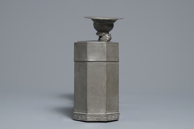 A large Chinese pewter double tea caddy with a central figure, impressed marks, 19th C.