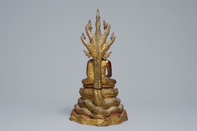 An inlaid gilt-lacquered bronze figure of Buddha, Burma, 19th C.