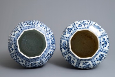 A pair of large Chinese blue and white octagonal baluster vases and covers, Kangxi