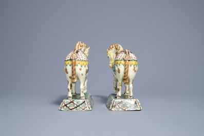 A pair of polychrome Dutch Delft lime-green ground models of circus horses, 19th C.