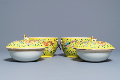 A pair of Chinese famille jaune tureens and covers with dragons and phoenixes, 19th C.