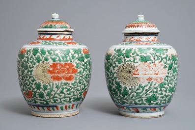 A pair of Chinese wucai jars and covers with floral design, Transitional period