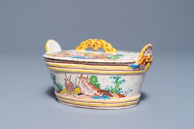 A polychrome Dutch Delft petit feu butter tub and cover with cows and goats, 18th C.