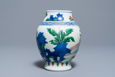 A Chinese wucai baluster vase with figures in a garden, Transitional period