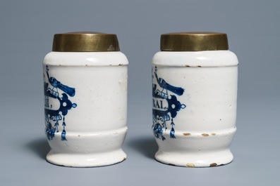 A pair of Dutch Delft blue and white drug jars with brass lids, 18th C.