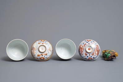 A pair of Chinese Imari style bowls and covers, a heart-shaped famille verte saucer and a sancai lion, Kangxi