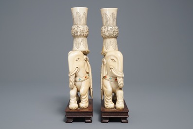 A pair of Chinese coral- and turquoise inlaid ivory elephant candlesticks, 19th C.