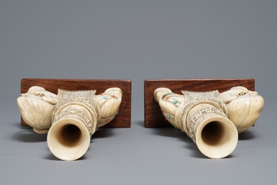 A pair of Chinese coral- and turquoise inlaid ivory elephant candlesticks, 19th C.