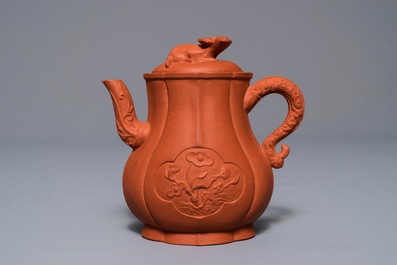 A Chinese Yixing stoneware wine jug with applied flowers and buffalo, Kangxi