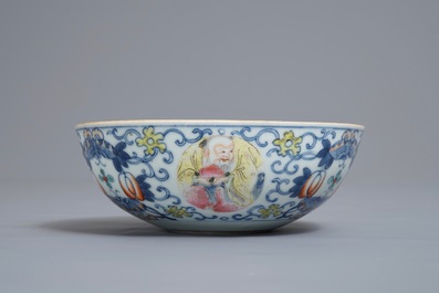 A Chinese famille verte vase and a famille rose bowl, 19th C.