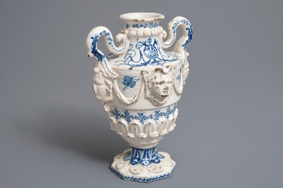 A Spanish blue and white two-handled vase with applied design and dedication, dated 1801