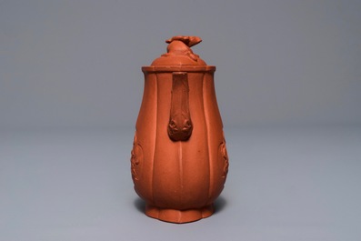 A Chinese Yixing stoneware wine jug with applied flowers and buffalo, Kangxi