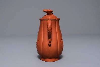 A Chinese Yixing stoneware wine jug with applied flowers and buffalo, Kangxi