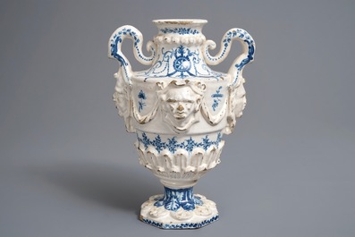 A Spanish blue and white two-handled vase with applied design and dedication, dated 1801